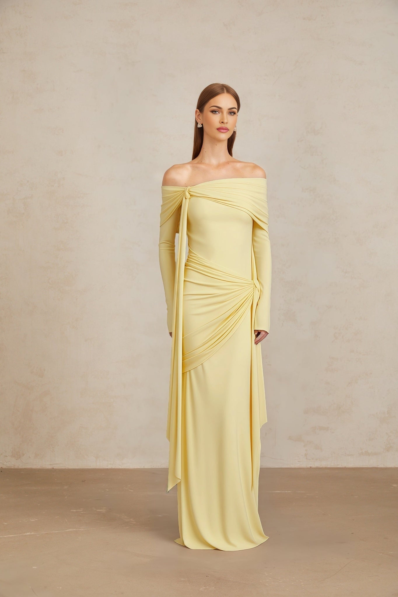 Yellow off the shoulder long sleeve dress with front tie detail and pleated, asymmetrical, ruched, and draped detailing