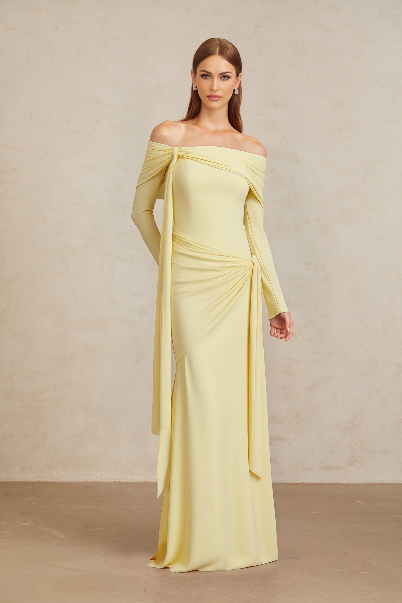 Yellow off the shoulder long sleeve dress with front tie detail and pleated, asymmetrical, ruched, and draped detailing
