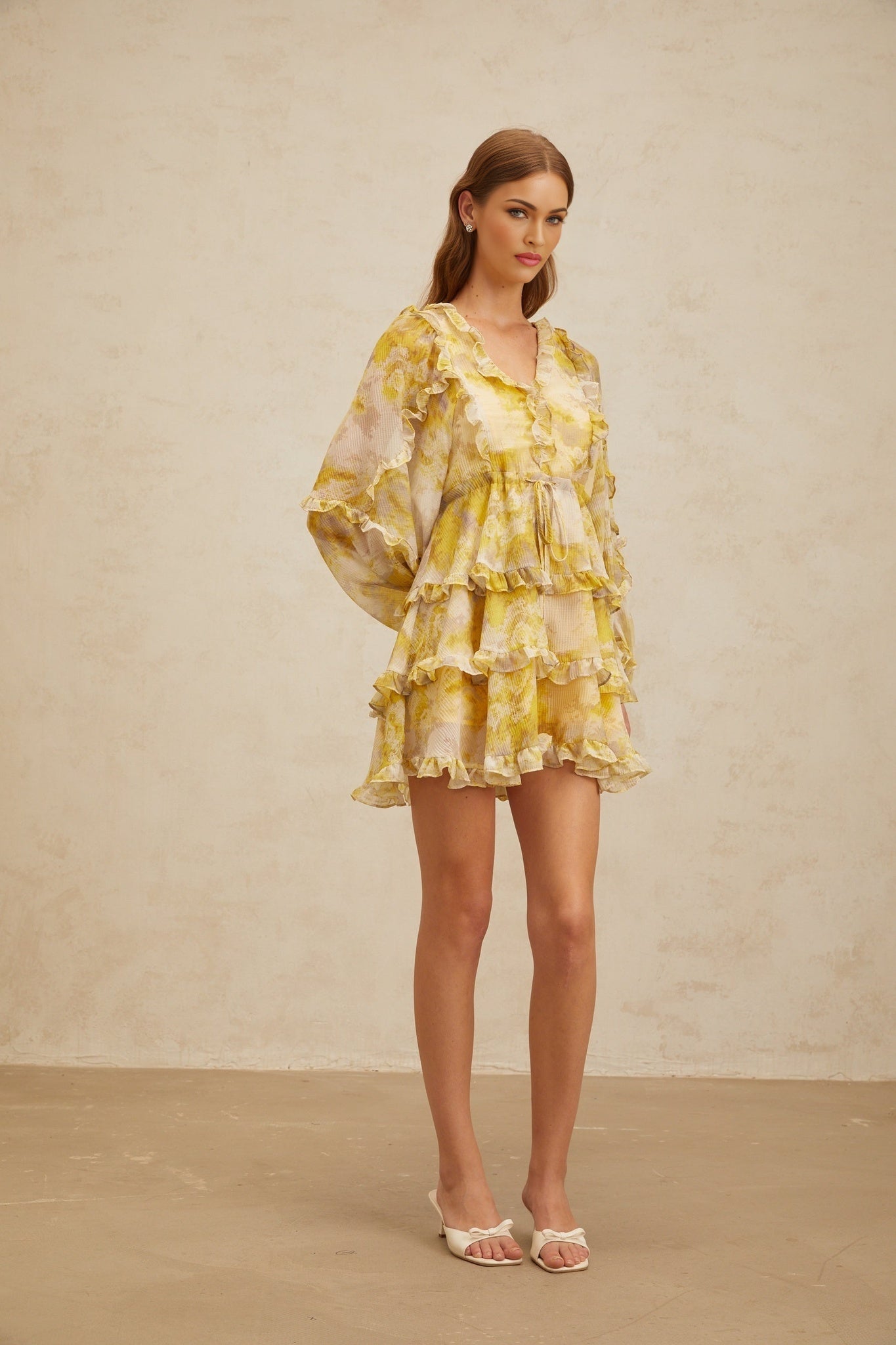 Yellow V-neck long puff sleeve dress with graphic print and ruffled trim