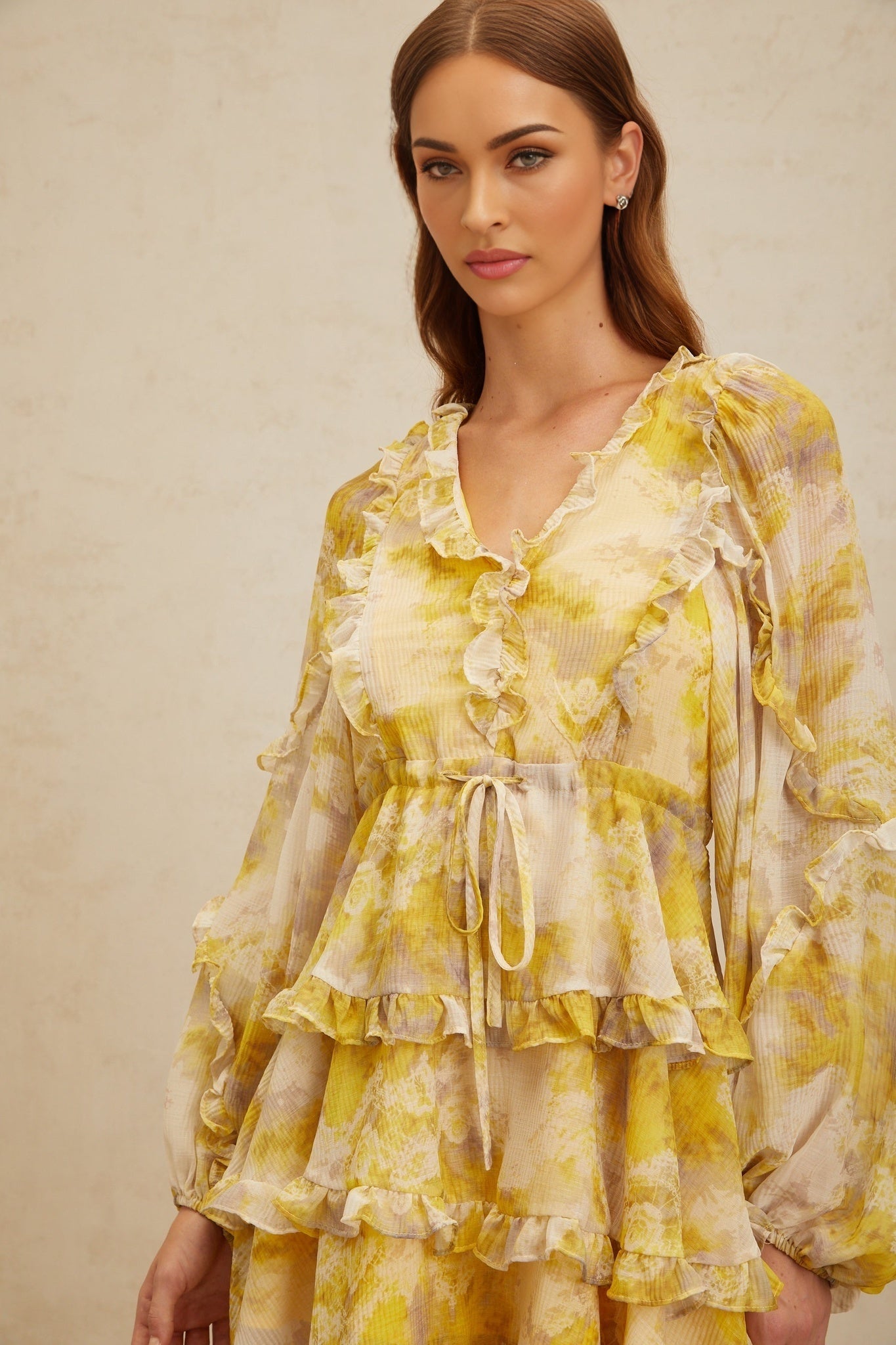 Yellow V-neck long puff sleeve dress with graphic print and ruffled trim