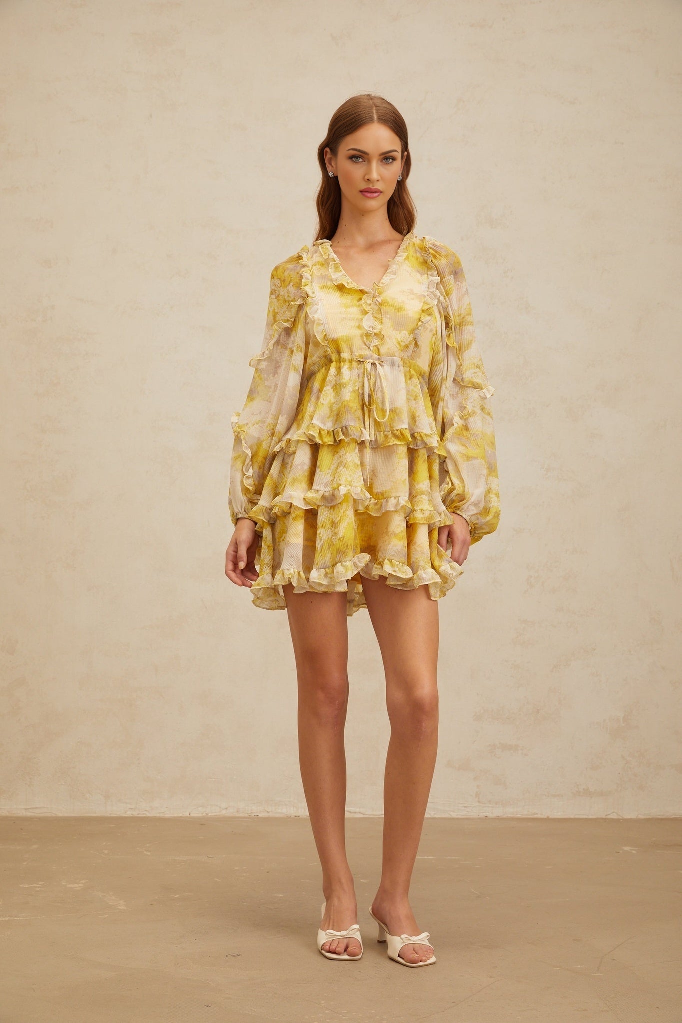 Yellow V-neck long puff sleeve dress with graphic print and ruffled trim