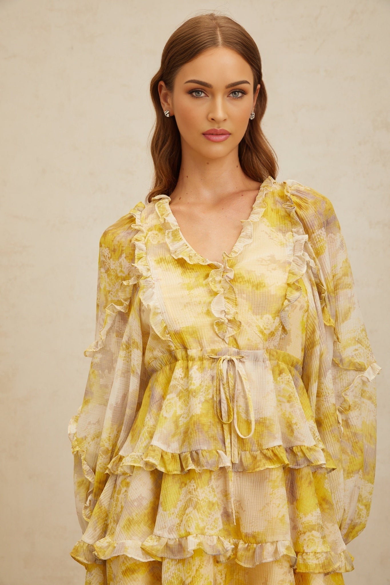 Yellow V-neck long puff sleeve dress with graphic print and ruffled trim