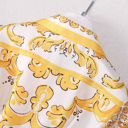 Bright yellow and white belted button-down dress with ornate details