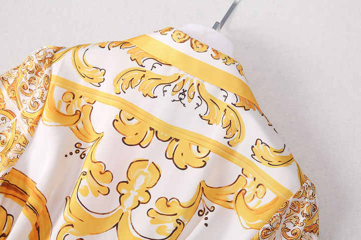 Bright yellow and white belted button-down dress with ornate details