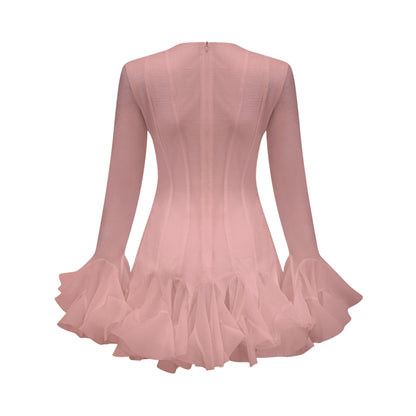 Young woman wearing a short semi sheer flared dress in light fabric with a flowy silhouette