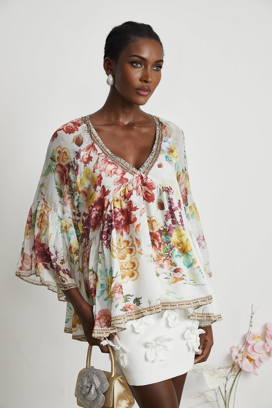 Yvonne White Floral Tulle V-neck Blouse Multicolor Embellished Trim Long Flared Sleeves Pleated Waist Detail