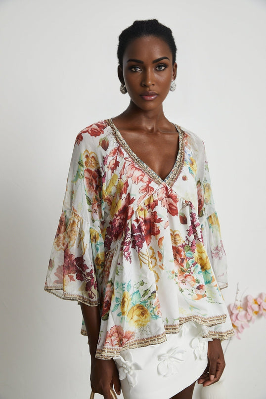 Yvonne White Floral Tulle V-neck Blouse Multicolor Embellished Trim Long Flared Sleeves Pleated Waist Detail