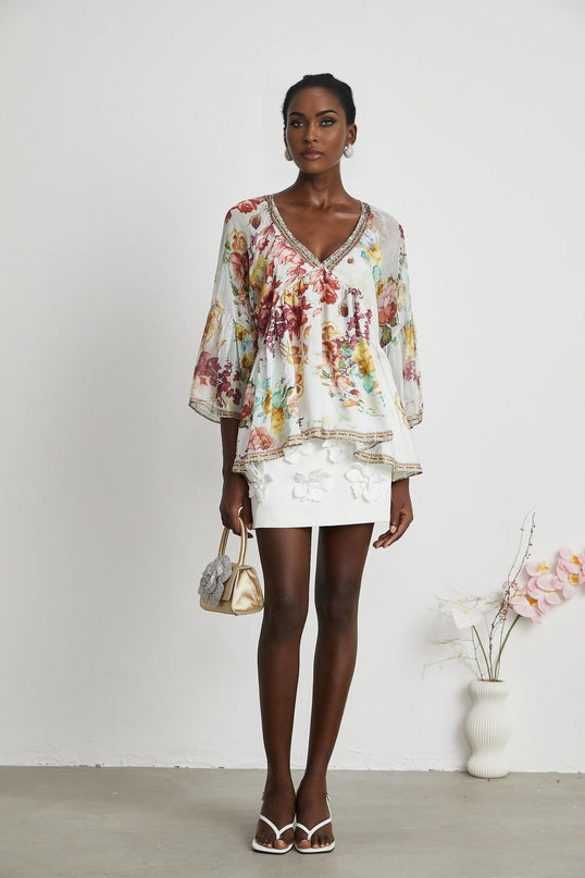 Yvonne White Floral Tulle V-neck Blouse Multicolor Embellished Trim Long Flared Sleeves Pleated Waist Detail