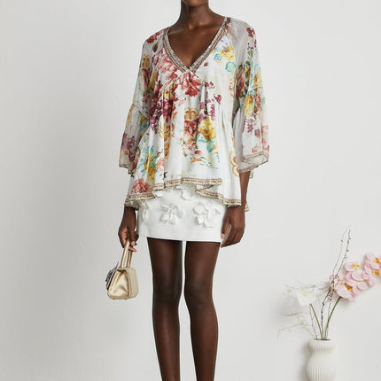 Yvonne White Floral Tulle V-neck Blouse Multicolor Embellished Trim Long Flared Sleeves Pleated Waist Detail
