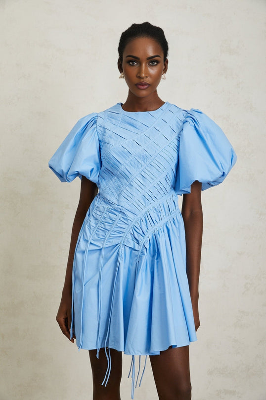 Zaira Mini Dress in Blue 100% Cotton Short Puff Sleeves Round Neck Ruched Detailing Fitted Waistline Drawstring Hem Shirred Panel Rear Zip Fastening Thigh-Length High-End Fashion