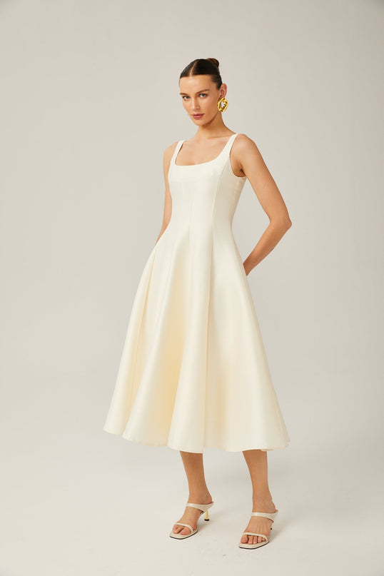 Zaylee Midi Dress in Ivory White Satin Finish Square Neck Wide Straps Dart Detailing Pleated Skirt Calf-Length Hemline Rear Zip Fastening 96% Terylene 4% Spandex