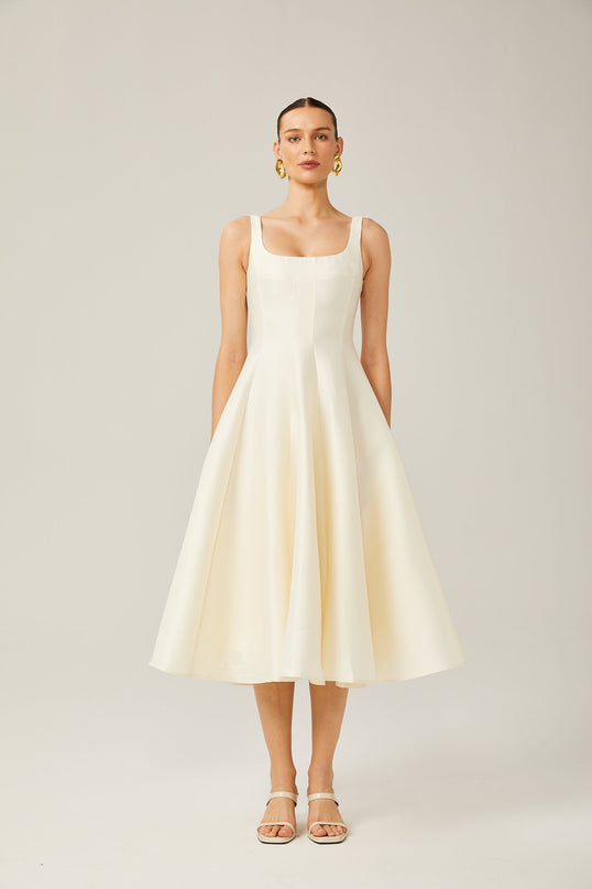 Zaylee Midi Dress in Ivory White Satin Square Neck Wide Straps Dart Detailing Pleated Skirt Calf Length Rear Zip Fastening 96% Terylene 4% Spandex