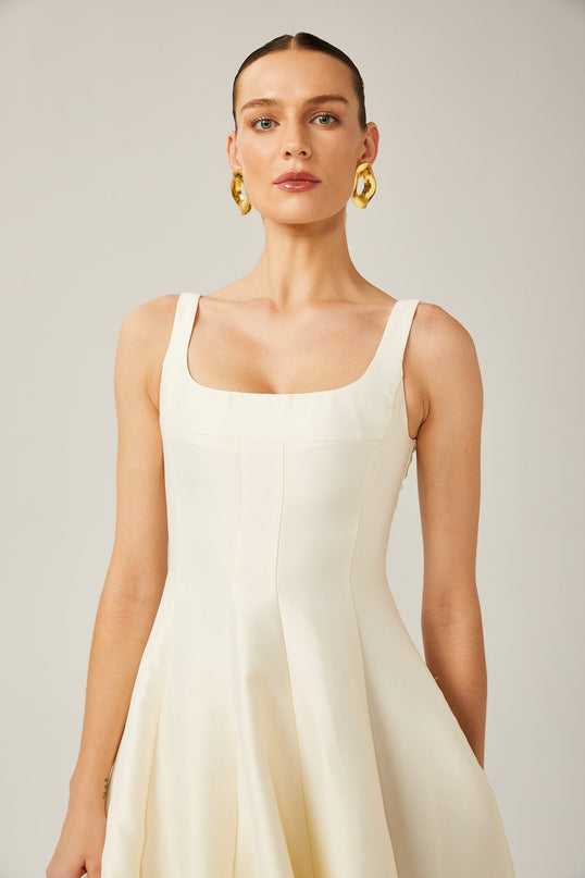 Zaylee Midi Dress in Ivory White Satin Finish Square Neck Wide Straps Dart Detailing Pleated Skirt Calf-Length Hemline Rear Zip Fastening 96% Terylene 4% Spandex