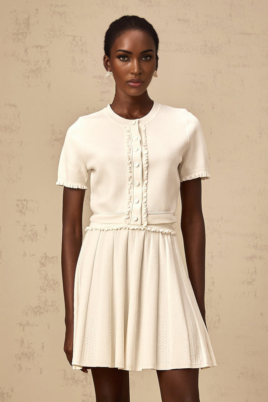 Zelda matching set featuring a white knit top with ruffled trim and a coordinating white skirt