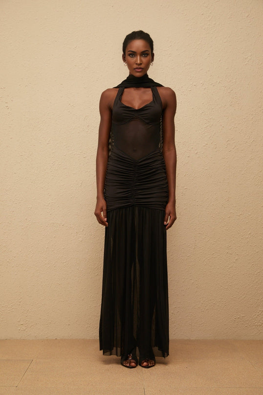 Zoe Maxi Dress Black Halterneck Gown Mesh Paneling Ruched Detailing Terylene Elastane Sheer Pleated Fitted Skirt Side Slit Open Back Scarf Design Goddess Glamour Allure Special Occasions